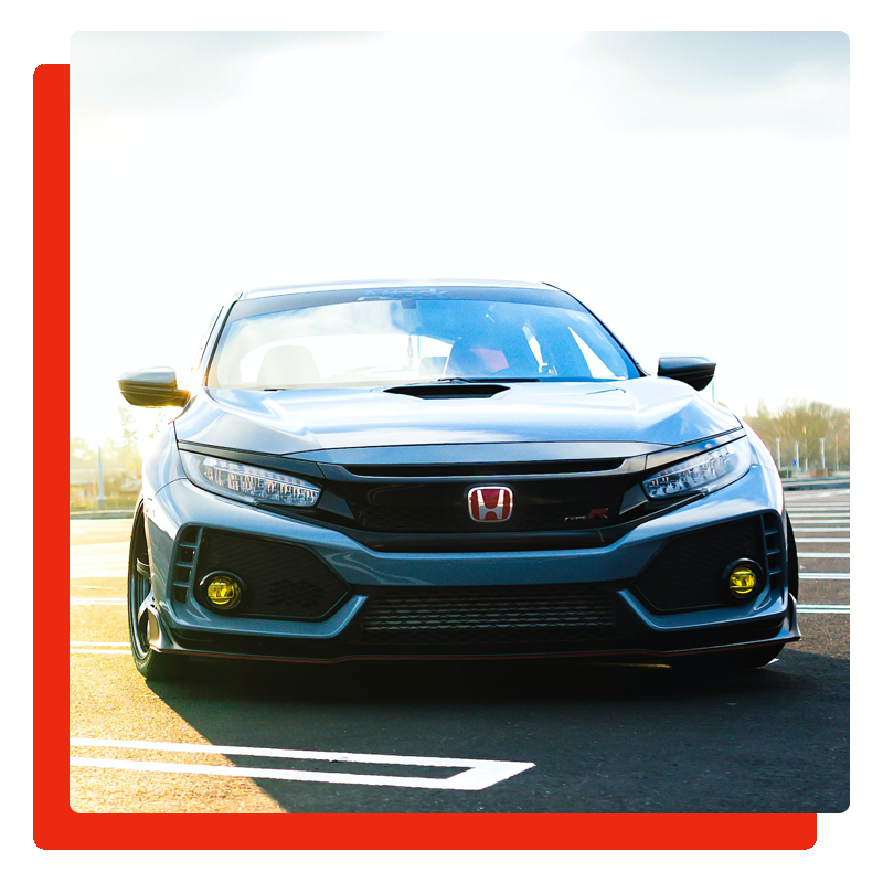 blue honda type-R car parked in the parking lot