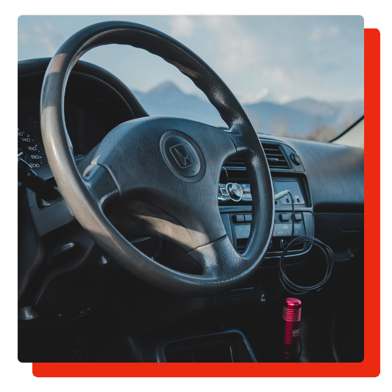 honda steering wheel with logo and panel, and a border on the left side